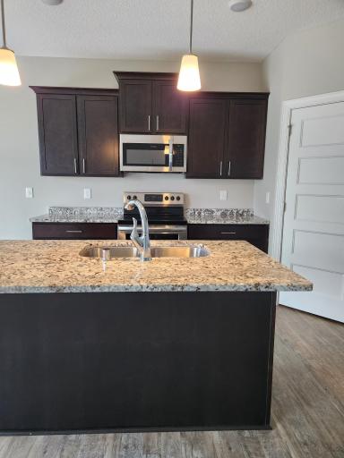 The kitchen features a pantry with a convenient door for extra storageâperfect for keeping things organized and tucked away.