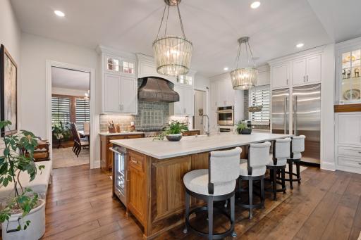 Large kitchen island with rare muted quartz countertops