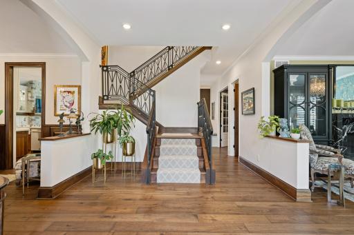 Inside you will be greeted by the custom staircase railings and gorgeous walnut floors