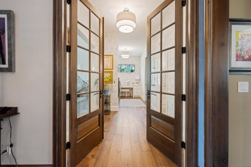 French doors lead to the rare main floor primary suite