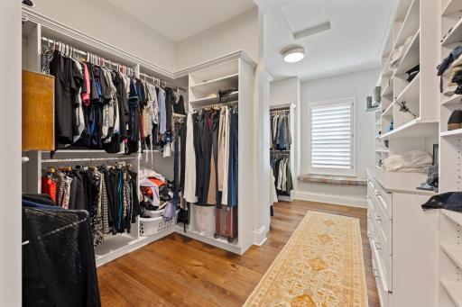 Primary Suite walk-in closet with natural light from the window