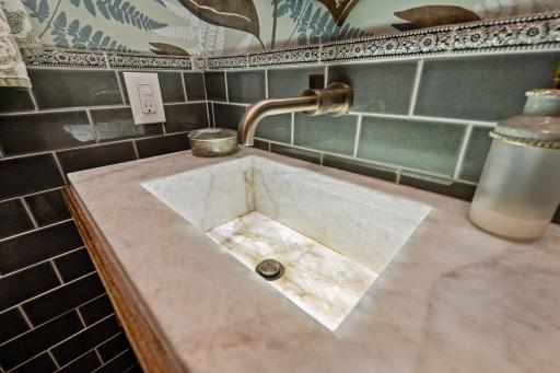Custom firstdibs vanity with lit marble sink