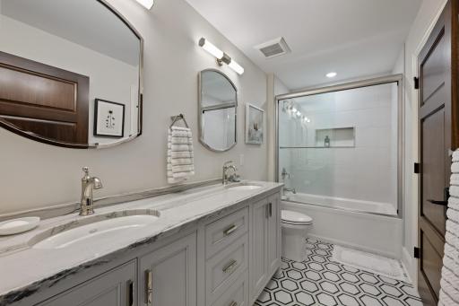 Upstairs bathroom with an additional washer & dryer in the closet