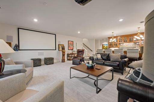 Basment living room with custom bar and projector