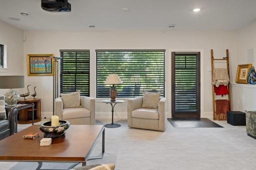 Walkout basement leads to built in gas firepit and water feature