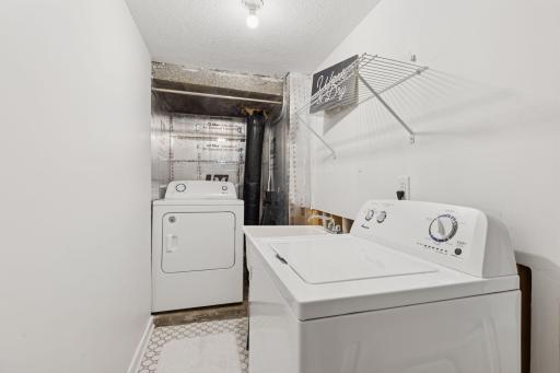 New Washer and Dryer Set with the convenience of a utility sink.