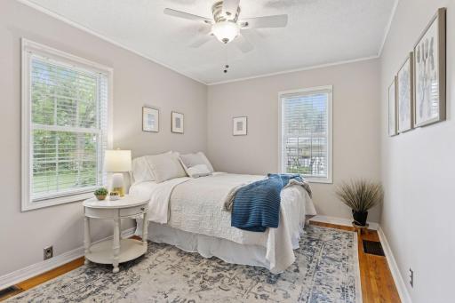 Spacious Bedroom on main level with plenty of sunshine, new blinds and ceiling fan.