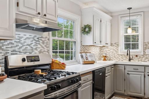 Stainless Steel appliances with Gas Range, Hood, Dishwasher and Refrigerator.