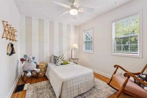 You will appreciate the custom painted wall, new blinds and ceiling fan in this main level bedroom.