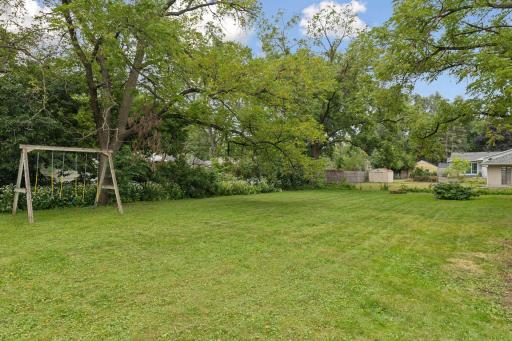 Enjoy the lush green private fenced backyard which is one of the largest lots in the area- .32 acres!
