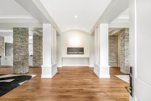 Grand foyer with 11â barrel vaulted ceilings, trimmed out modern columns and exquisite stone pillars