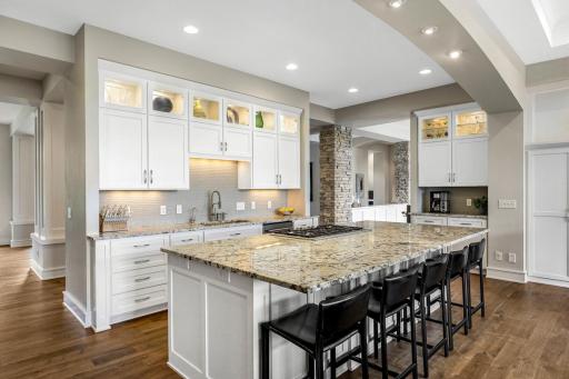 The kitchen flows seamlessly into the great room and formal dining room