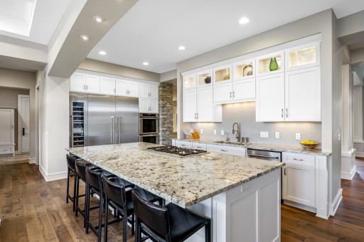 The kitchen is a statement of design and performance â Thermador appliances, custom cabinetry and granite surfaces