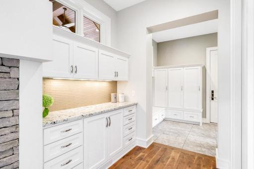 Pantry and butler's pantry off the kitchen lead to the mudroom/laundry room