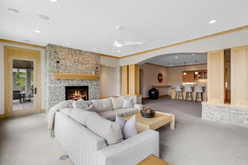 Walkout lower level leads to covered patio in backyard