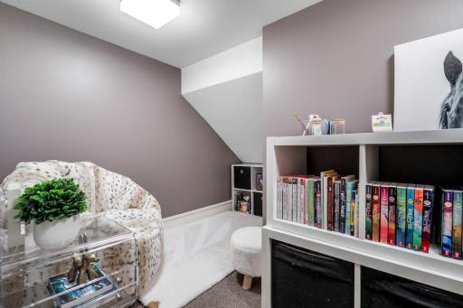 A door in the closet leads to this fun secret playroom or reading nook