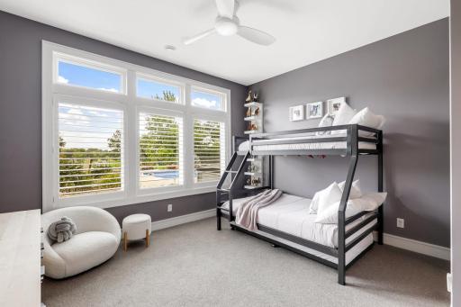 Lowel level bedroom with walk-in closet featuring a secret playroom