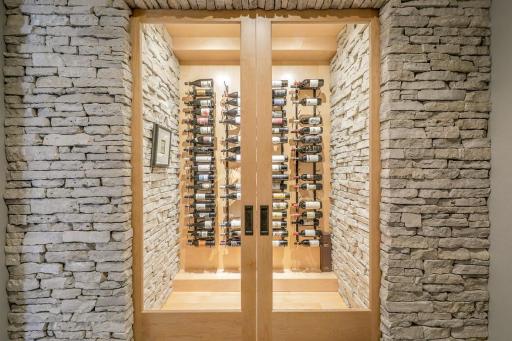 â¢	Stone-wrapped wine room in lower level with glass French doors