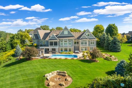 Experience resort-style living on 1.87 immaculate acres overlooking a championship golf course.