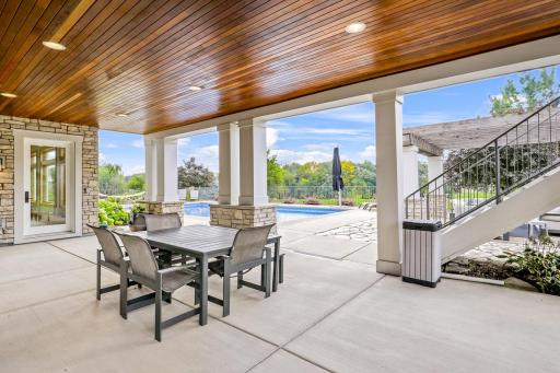 Huge covered patio in backyard with tongue and groove ceiling
