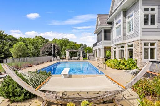 Opposite from the pool is the poolside pergola to catch some shade
