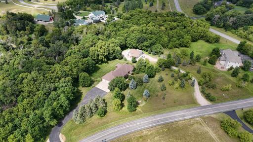 Welcome to your private retreat in one of the area's most sought-after neighborhoods—nestled on a quiet, low-traffic road surrounded by mature trees and teeming with wildlife
