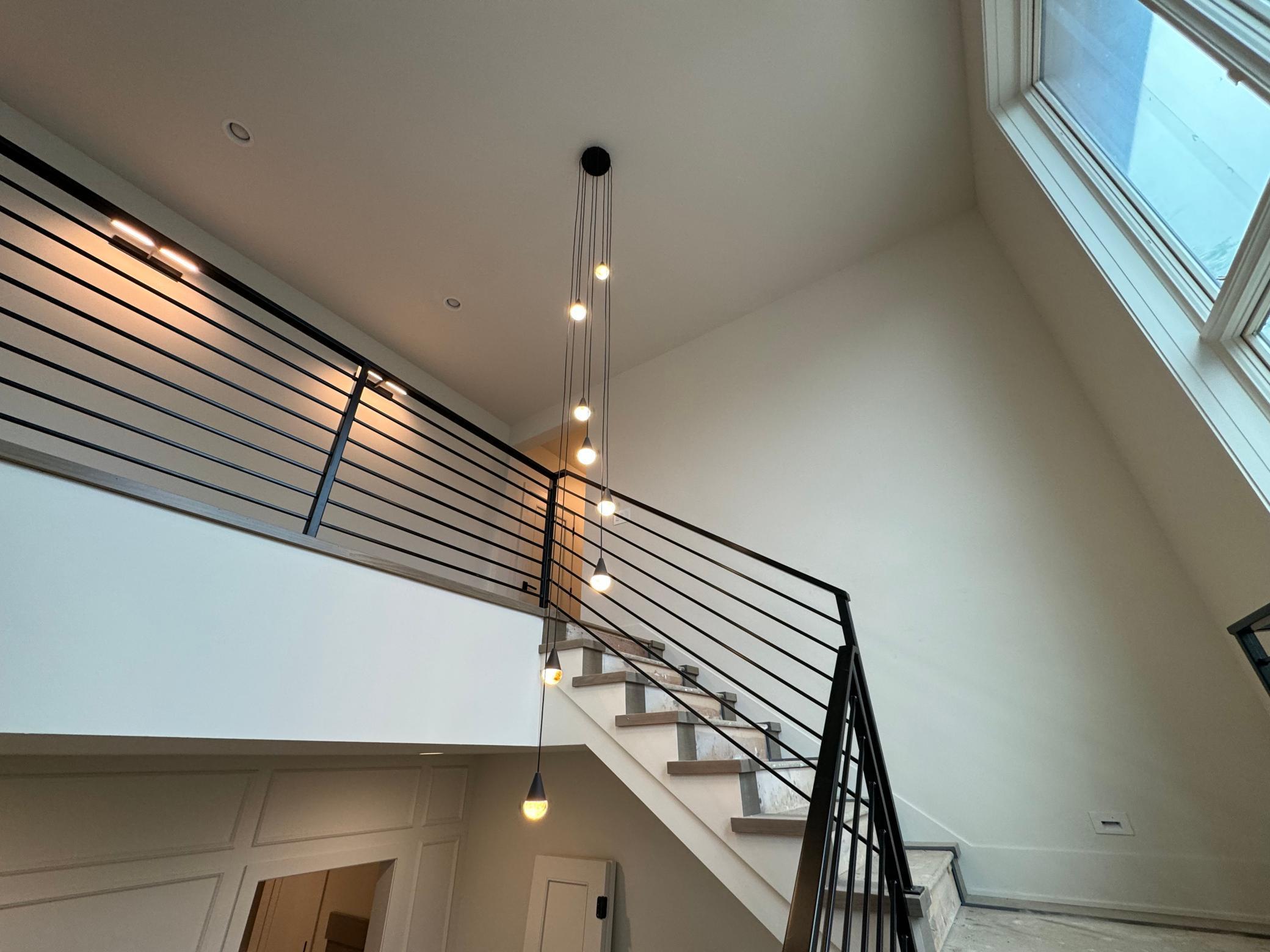 lovely stairwell with designer lighting