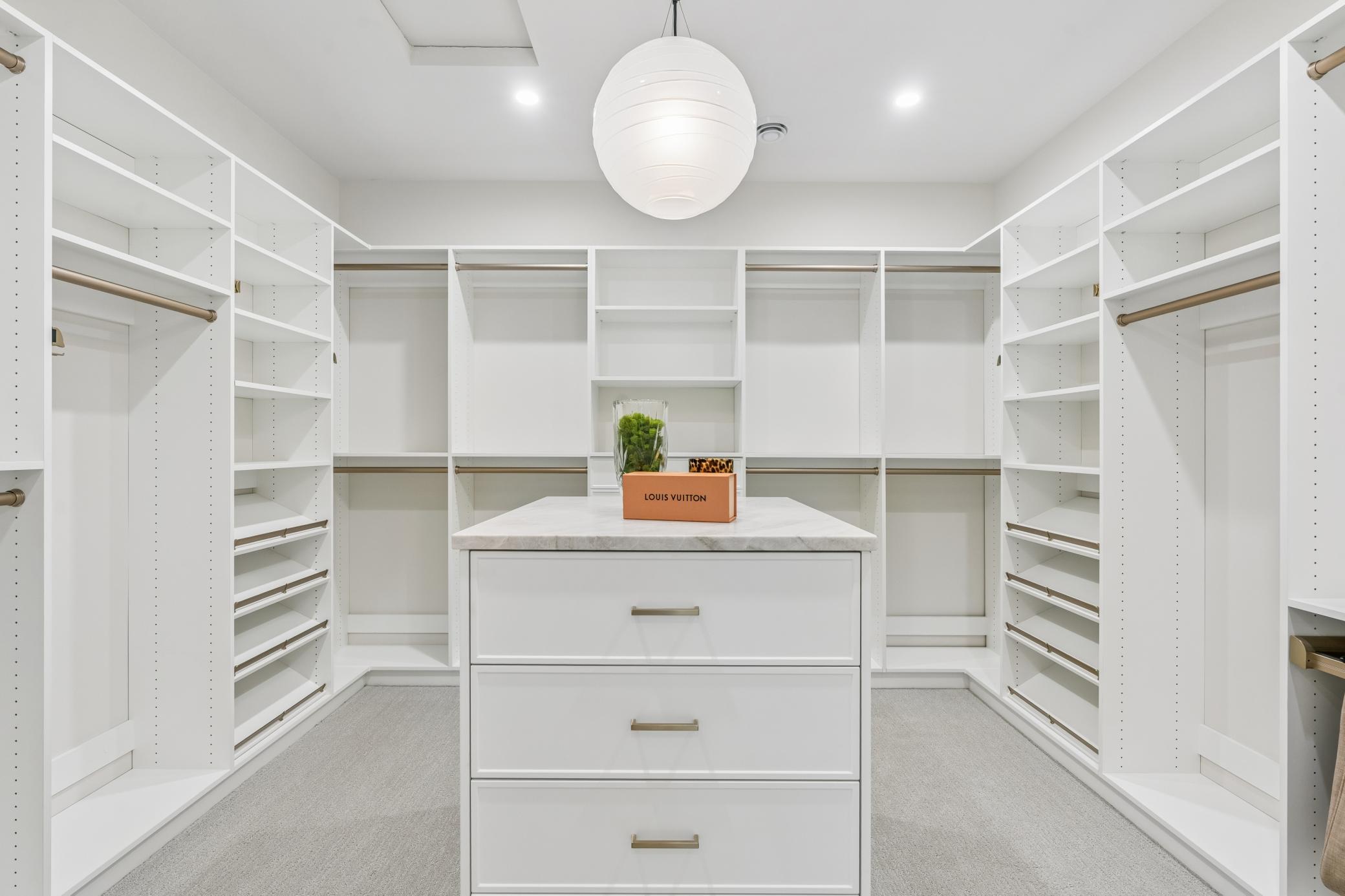 incredibly built out master closet - taj mahal countertop