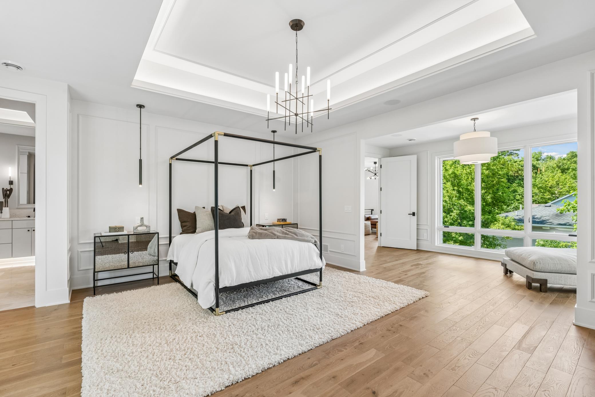 Incredible master suite with lounge area, limestone fireplace, excellent ceiling lighting details, private deck, large bathroom and walk in closet