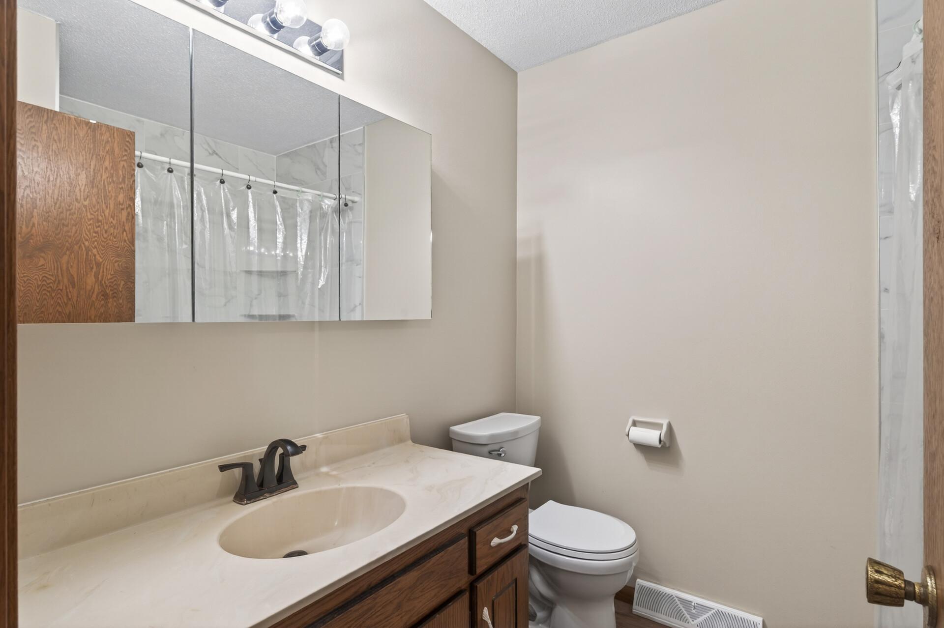 Updated bath with tile shower