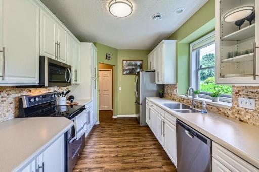 1/2 bath, utilities and garage through the kitchen