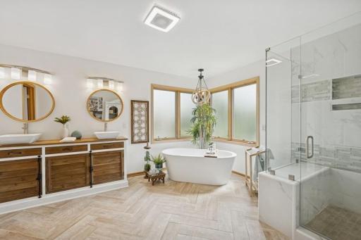 Photo for 18397 Smith Court NW, Elk River, MN 55330 - listing #6787495 The primary suite offers a private spa-inspired bath with a tiled walk-in shower, double sinks, and a spacious closet.