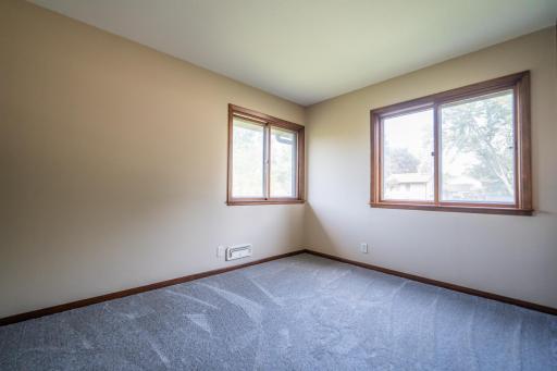 Second bedroom on the main level is spacious with a large closet.