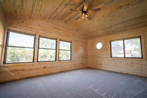 Beautiful tongue and groove four season porch that you can appreciate and enjoy year round. Beautiful views of the private backyard. Door leads to deck in backyard