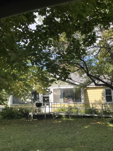 Front of home. Has wheelchair accessible ramp.