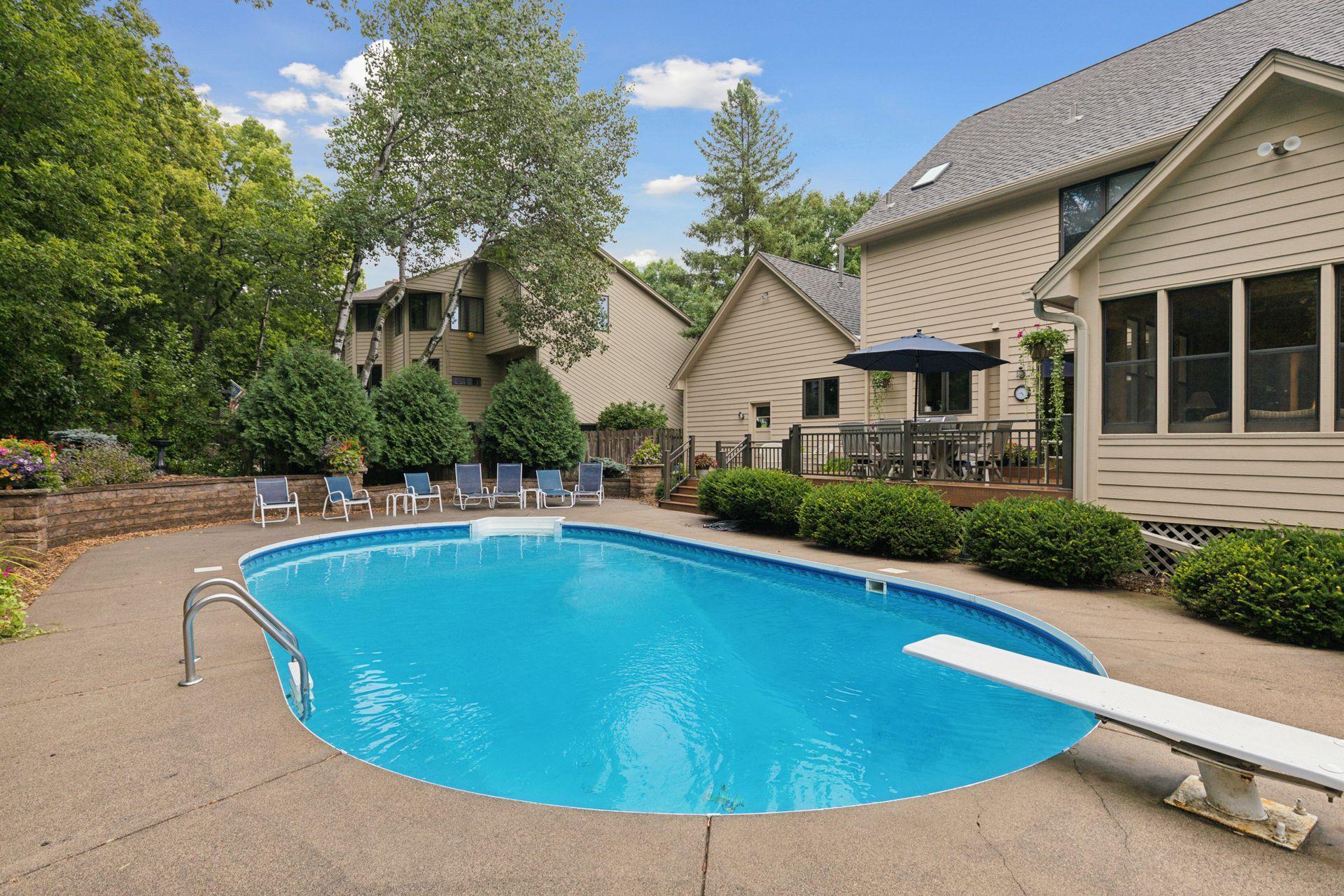 Private, underground heated pool with diving board
Expansive concrete patio for lounging and entertaining. Professionally maintained pool (weekly service by Sparkle Pools)