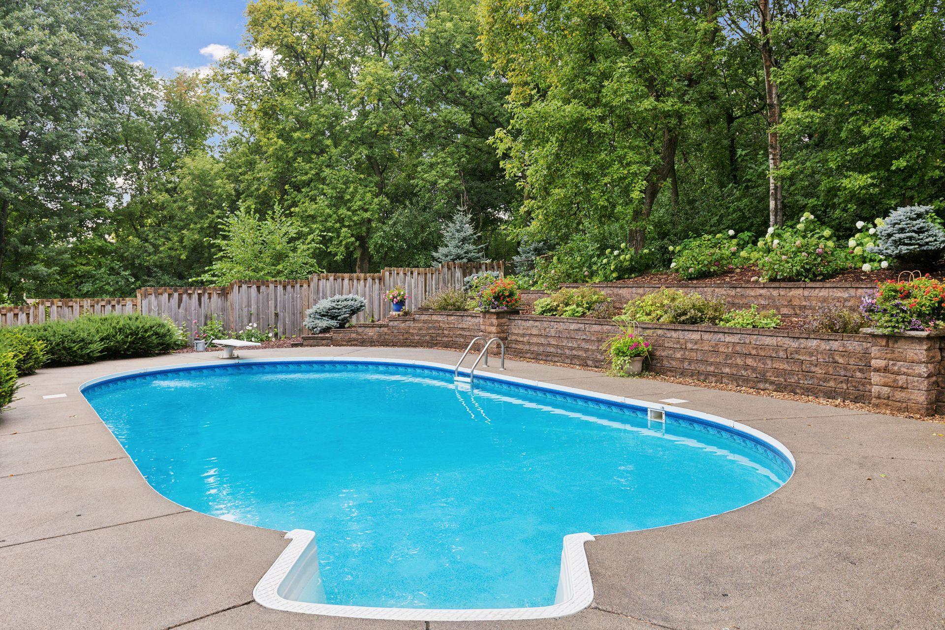 Thoughtfully designed landscaping with newer retaining wall for added privacy