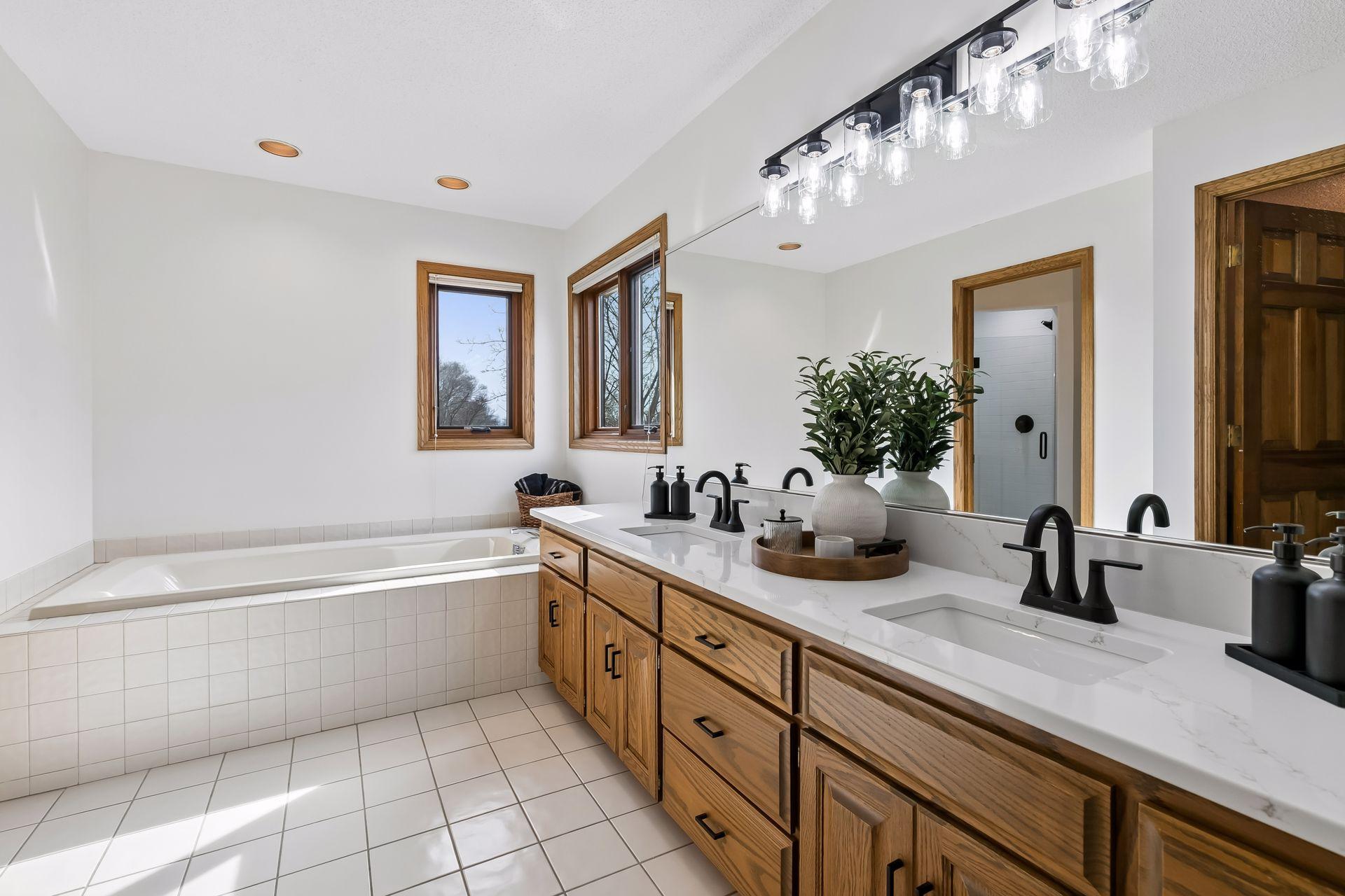 Spacious owner’s suite (17x14) with remodeled private bath (2026)
Quartz countertops, updated fixtures, refinished cabinetry, tiled shower.