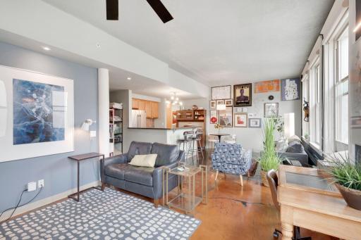 Warm terrazo and polished concrete flooring throughout