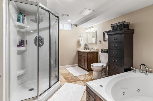 The lower level full bathroom has a separate shower and jetted tub.