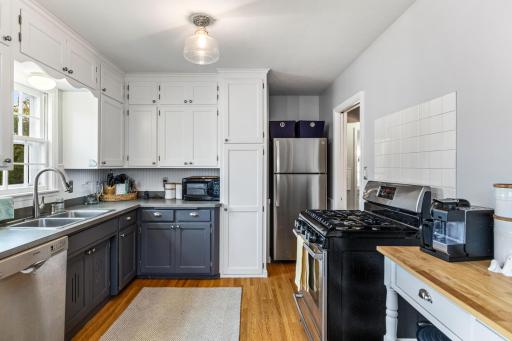 The kitchen has substantial cabinet space.