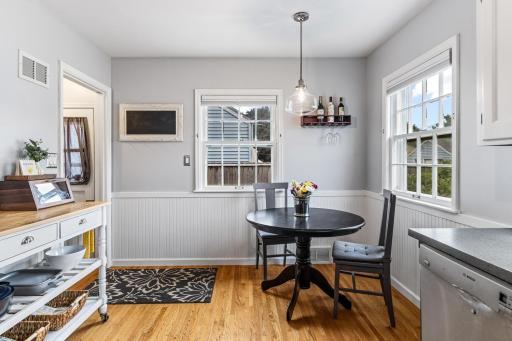 Convenient eat-in kitchen overlooks the beautiful backyard.