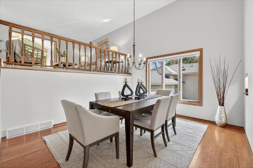 The spacious dining room on the main level is great for entertaining. The room can accommodate a large table and chairs plus has plenty of room for your hutch and offers hardwood flooring.