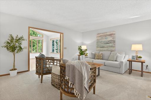 Head upstairs and you'll find this large living room that features BRAND NEW CARPETING!