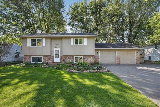 Welcome to this charming split-level home featuring timeless curb appeal. A well-manicured lawn, mature trees, and landscaped garden beds create an inviting first impression. (Exterior painted in 2024)