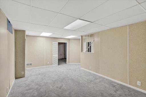 Lower level family room with tall ceilings
