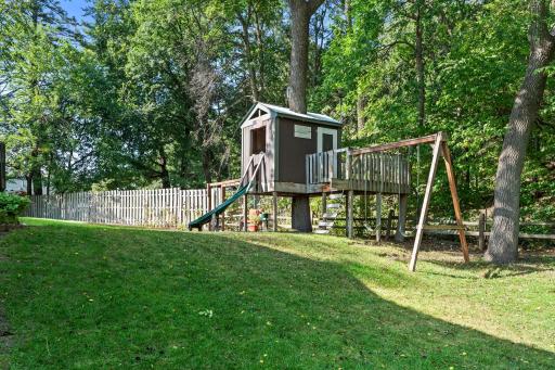 Private wooded setting and play house with swing set & slide