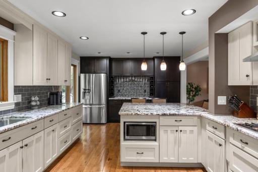 Granite counter tops, recessed lighting, tiled backsplash