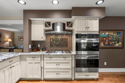 Double convection wall ovens, gas cook top with luxury pot filler faucet, soft close cabinetry