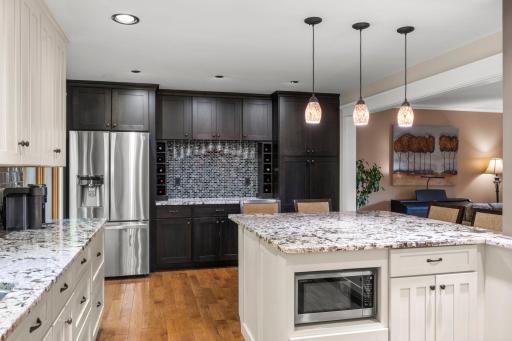 Built in buffet area with plenty of storage and overhead wine glass racks